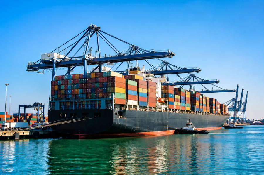 Cargo container ship at port for global freight forwarding services